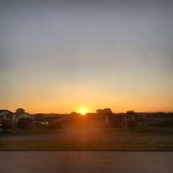 Scenic view of field against sky during sunset