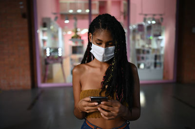 Young woman using mobile phone