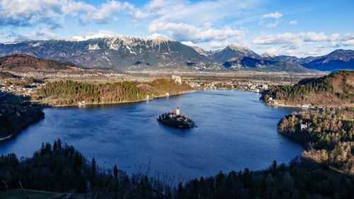 Scenic view of lake and mountains against sky