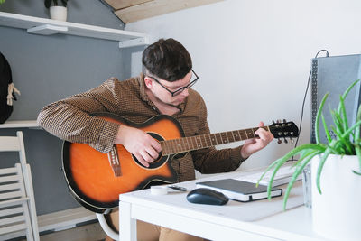 Woman playing guitar