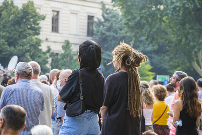 Rear view of people enjoying in park