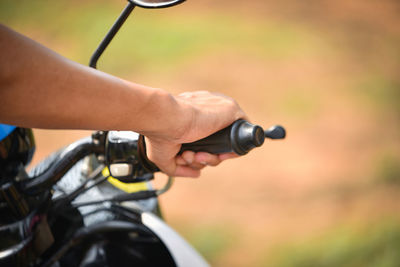 Close-up of man riding motorcycle