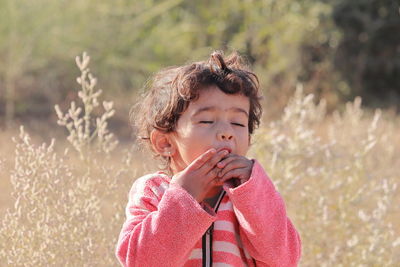 An indian little child enjoying fruits in the forest, india