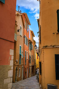 Street amidst buildings against sky