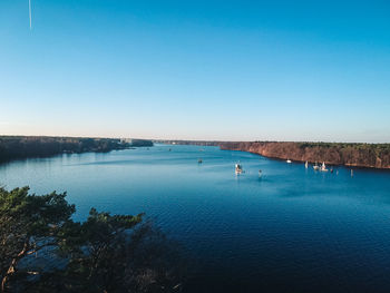 Scenic view of sea against clear blue sky