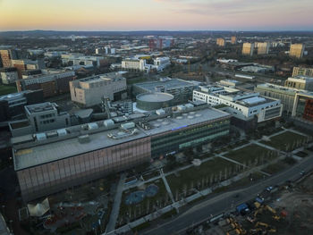 High angle view of buildings in city against sky