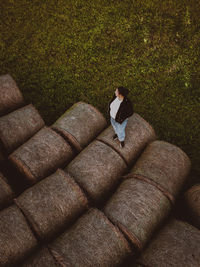 High angle view of woman sitting on grass