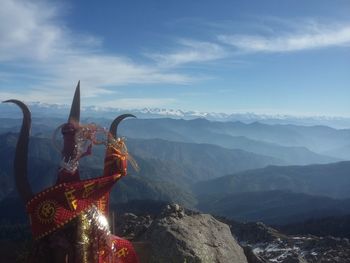 Scenic view of mountains against cloudy sky