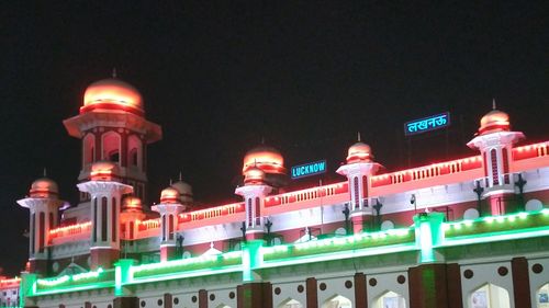 Low angle view of illuminated building against sky at night