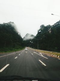 Road seen through car windshield