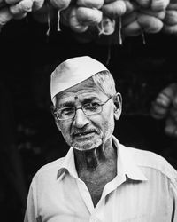 Senior man wearing eyeglasses looking away