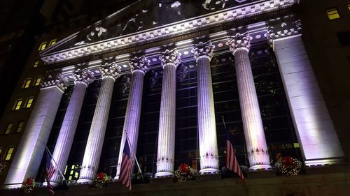 Low angle view of statues at night