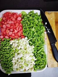 High angle view of chopped vegetables on cutting board