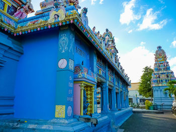 View of temple building against blue sky