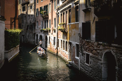 Canal amidst buildings in city