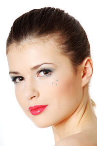 Close-up portrait of a beautiful young woman over white background