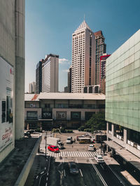 City street and modern buildings against sky