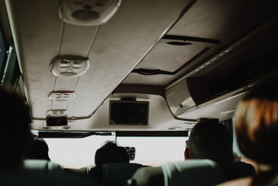 Rear view of people sitting in airplane