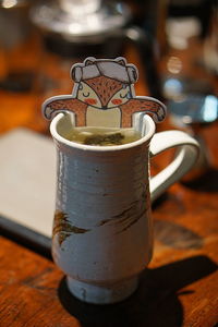 Close-up of coffee cup on table
