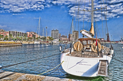 Boats moored at harbor