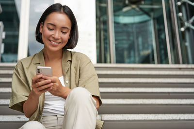 Young woman using mobile phone