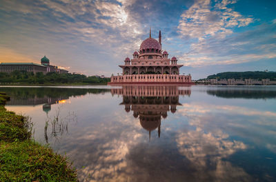 Putra mosque with reflection in lake against sky
