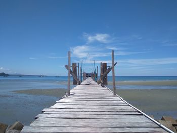 Pier over sea against sky