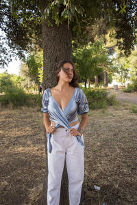 Beautiful italian girl at the park, wearing a dress