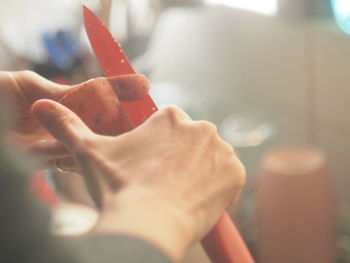 Close-up of hand holding ice cream
