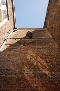 Low angle view of bell tower against sky