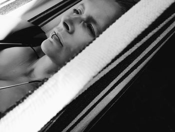 Close-up portrait of young woman in car