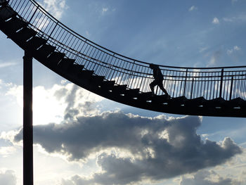 Low angle view of silhouette bridge against sky during sunset