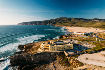 Aerial view of wild coastline facing the atlantic ocean near praia do guincho in cascais, portugal