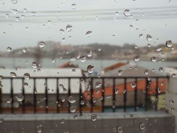 Full frame shot of wet glass window in rainy season