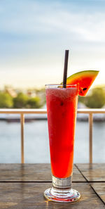 Close-up of red drink on table