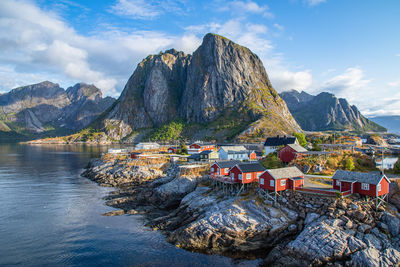 Scenic view of sea and mountains against sky