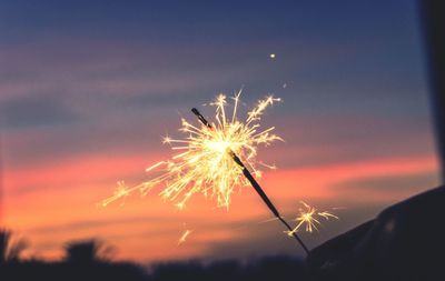 Low angle view of firework display at night