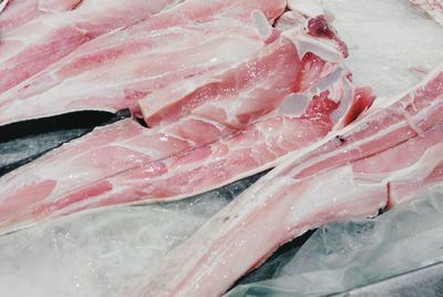 High angle view of raw fish on ice at market