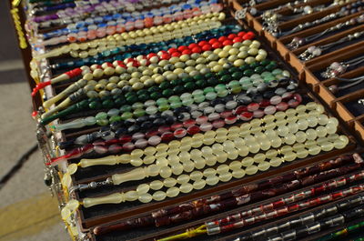 High angle view of multi colored rosary on table