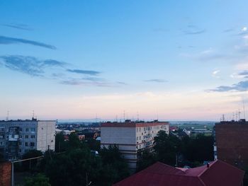 High angle view of buildings against sky at sunset