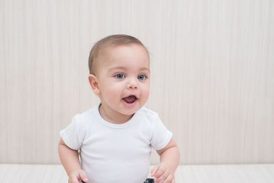 Portrait of cute baby at home