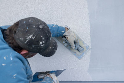 High angle view of boy standing on snow