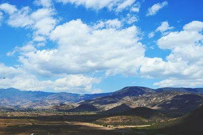 Scenic view of landscape against cloudy sky