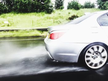 Cropped image of car on road