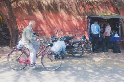Man cycling on bicycle in city