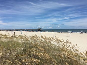 View of beach against cloudy sky