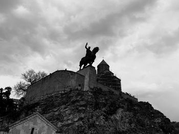 Low angle view of statue against sky