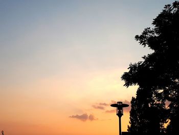 Low angle view of street light against sky during sunset