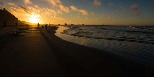 Scenic view of beach during sunset