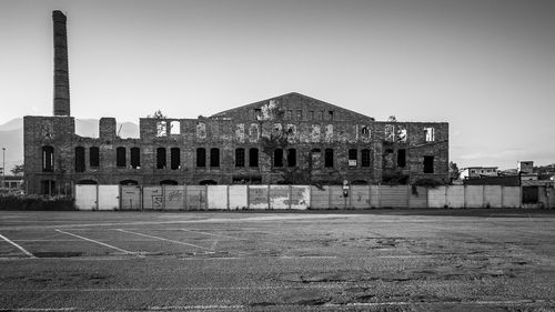 View of abandoned building against clear sky